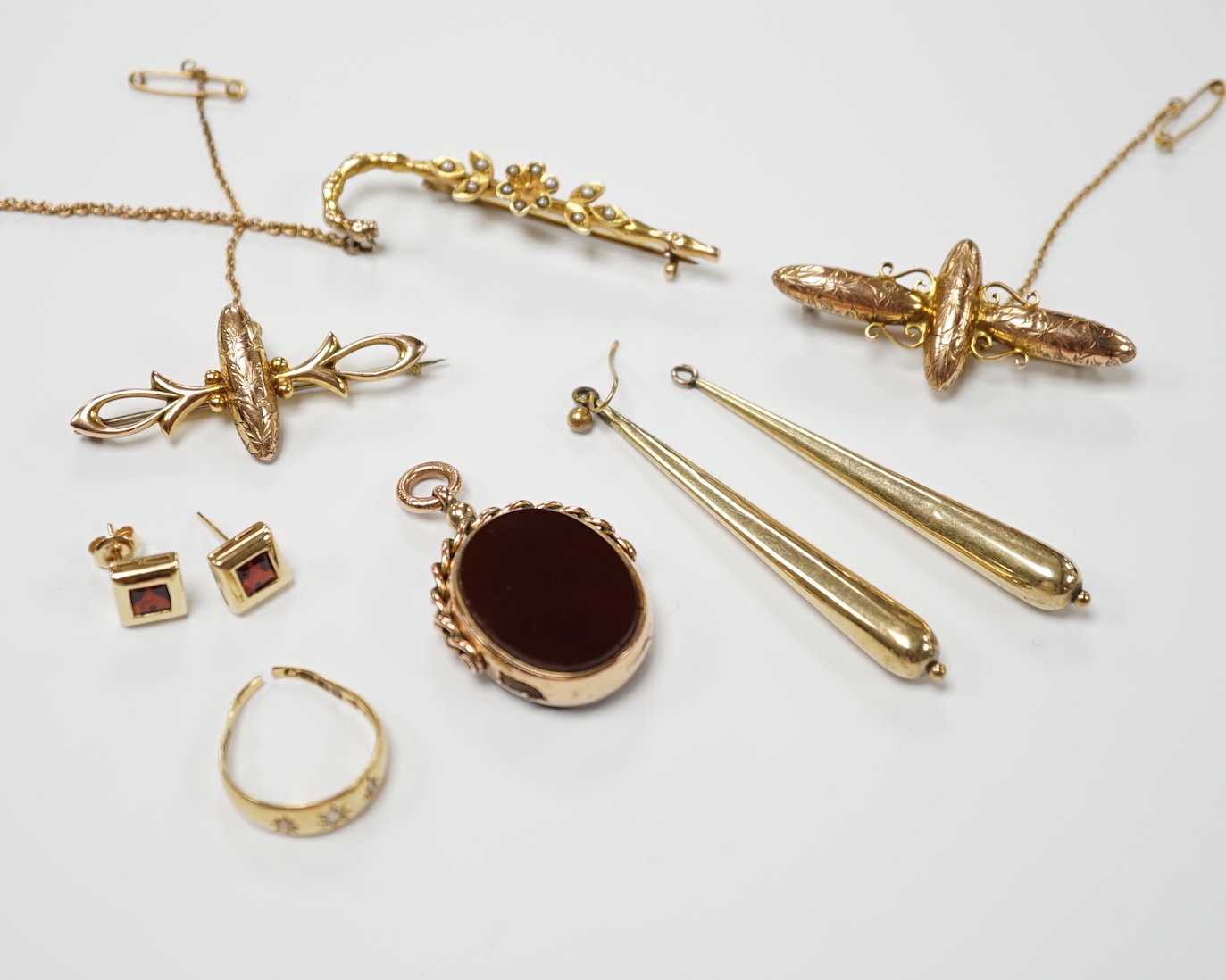 A group of Victorian and later jewellery including a yellow metal overlaid, carnelian and bloodstone set fob, yellow metal and seed pearl set cane bar brooch, earrings, ring etc.